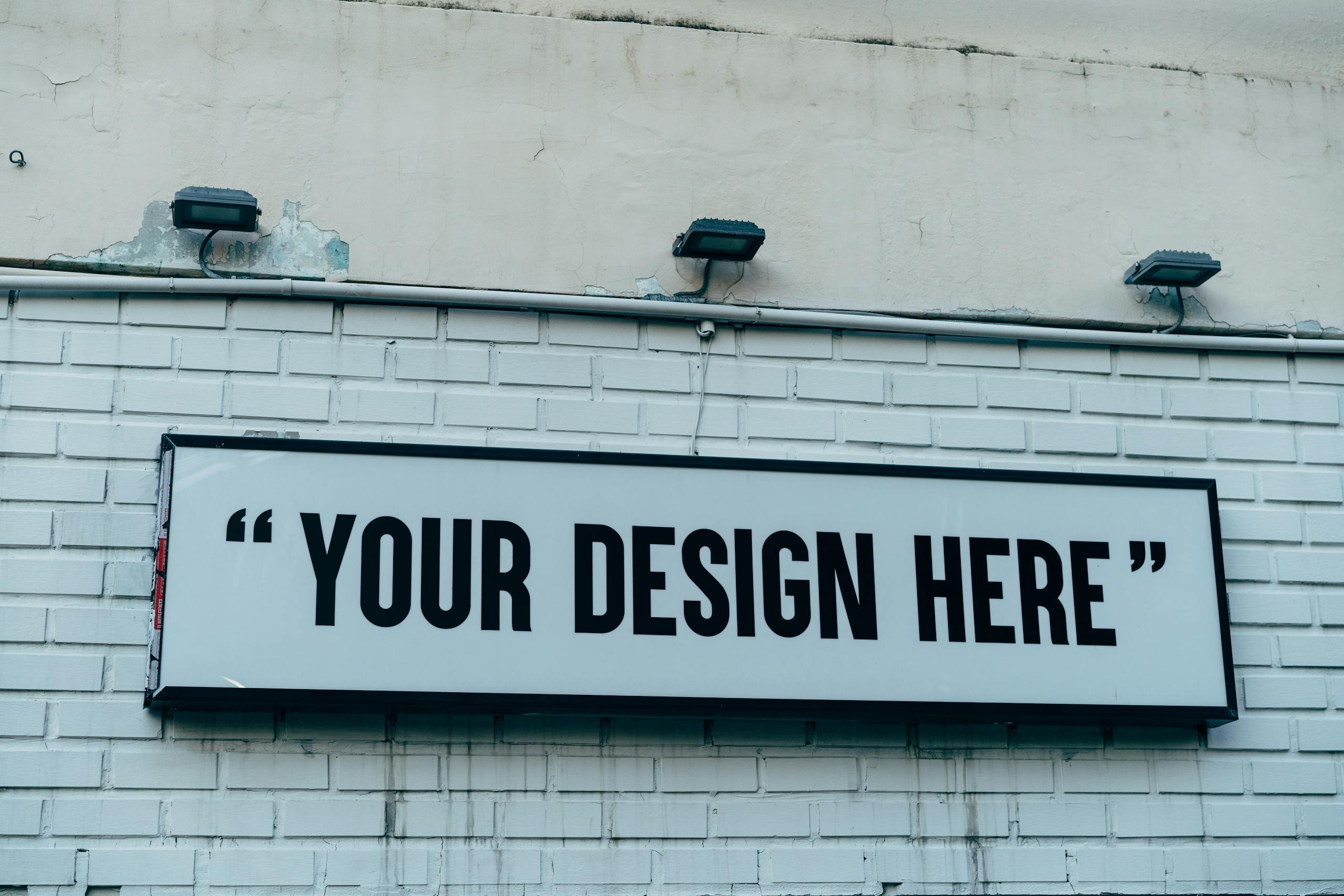 Blank urban wall sign for showcasing custom designs or messages outdoors.