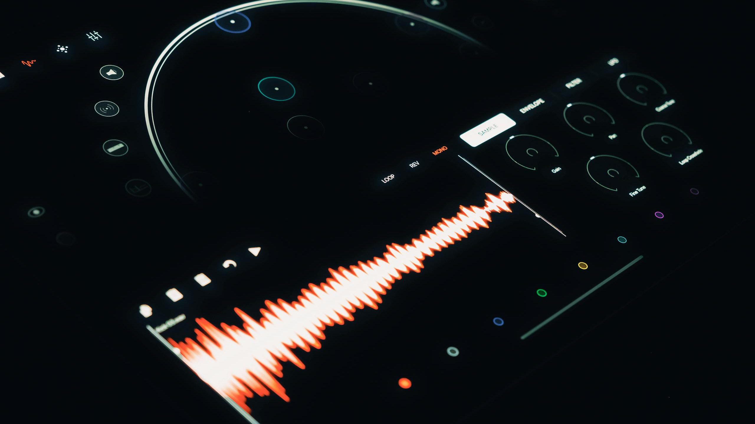 Close-up of a digital audio interface displaying a vibrant sound wave and control elements.